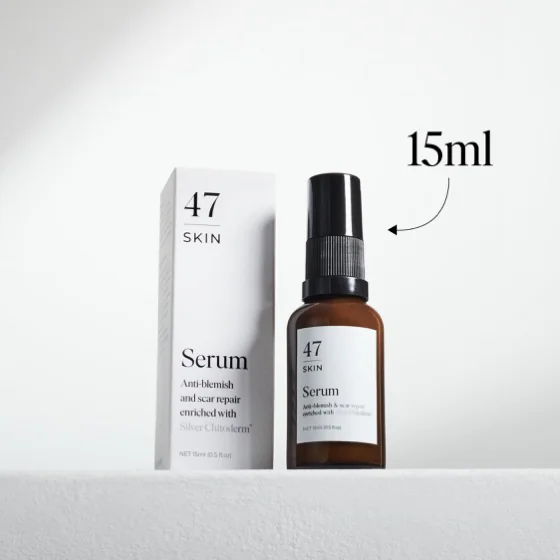 The 15ml trial size 47 Skin serum, an amber pump bottle standing beside its white carton
