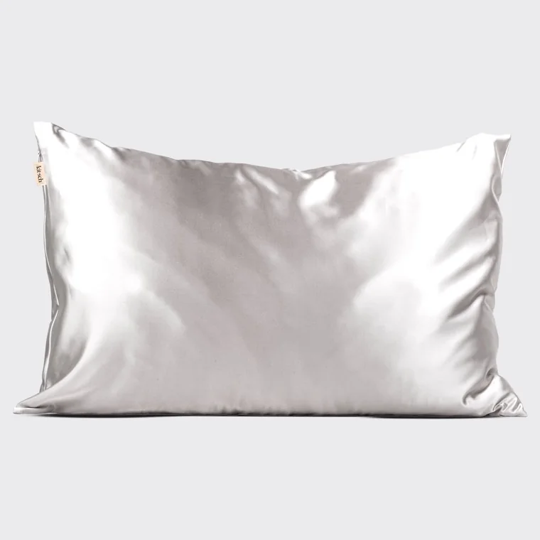 The Silver satin pillowcase on its own against a plain background, with a zipper pull and a small woven Kitsch tag at the top left corner