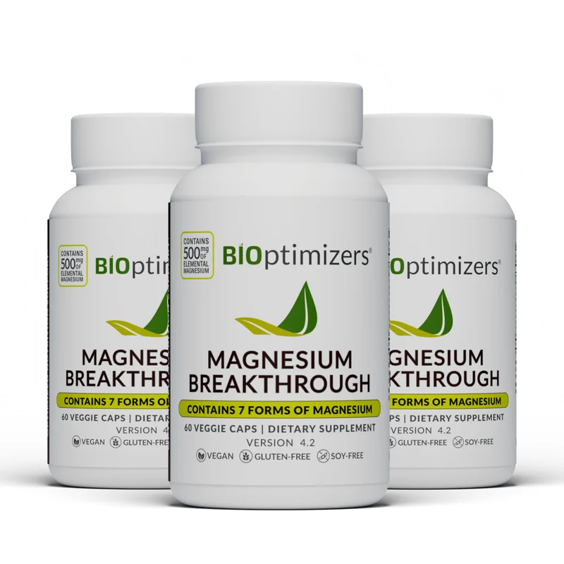 Three Magnesium Breakthrough bottles arranged together, the manufacturer's own photograph of the three-bottle pack, each label reading Contains 7 forms of magnesium, 60 veggie caps, Version 4.2