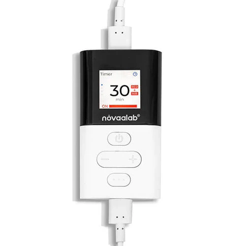 The Light Pad handheld controller, white with a small screen reading Timer 30 min ON, and power, minus and plus buttons below it