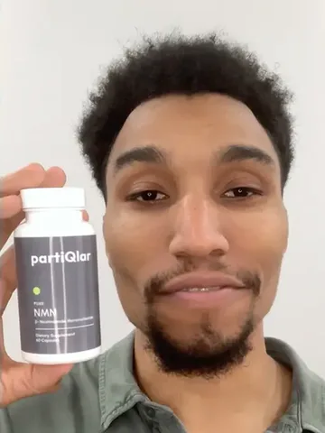 Man holding a bottle of PartiQlar Pure NMN, from the brand's marketing creatives
