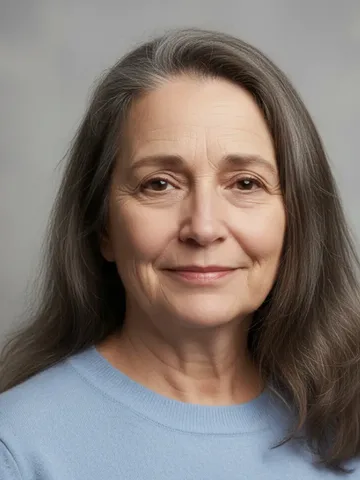 Gray-haired woman with a soft smile, from partiQlar's marketing creatives