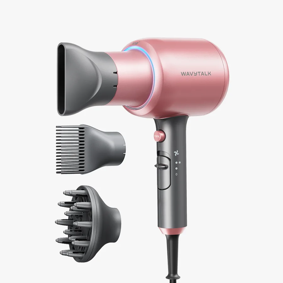 The Wavytalk Blown Away Ionic Hair Dryer in Rose Gold with the concentrator fitted, next to the comb nozzle and the diffuser, on a plain background