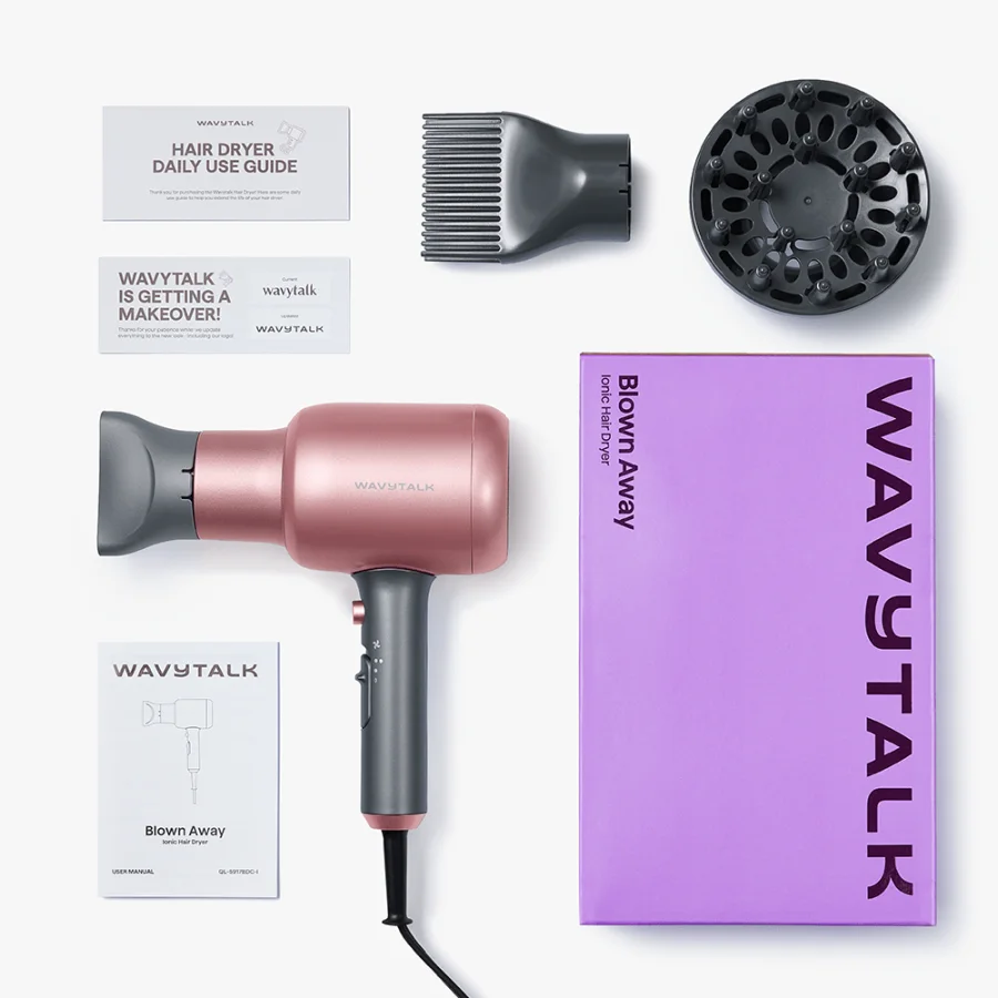 Flat lay of the Blown Away box contents photographed by Wavytalk: the lilac box printed WAVYTALK and Blown Away Ionic Hair Dryer, the rose gold dryer with the concentrator fitted, the comb nozzle, the diffuser, a Hair Dryer Daily Use Guide card, a card reading Wavytalk is getting a makeover, and the user manual marked QL-5917BDC-I